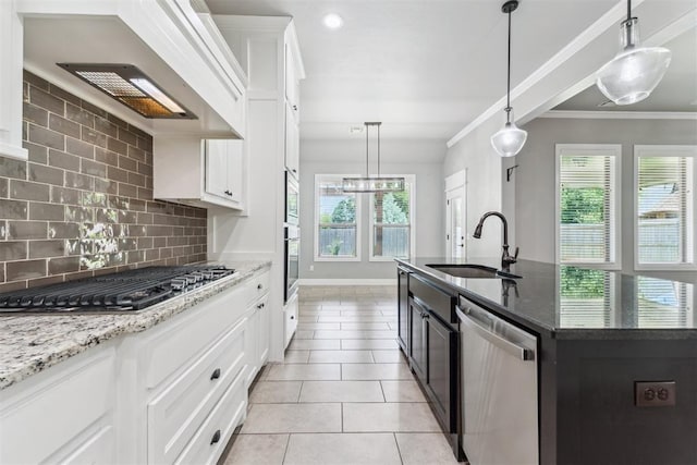 9041 NW 147th Ter, Yukon, OK 73099 - kitchen with appliances with stainless steel finishes, healthy amount of natural light, decorative backsplash, crown molding, and light tile patterned floors