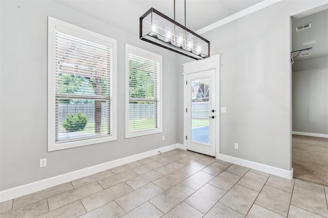 9041 NW 147th Ter, Yukon, OK 73099 - unfurnished dining area featuring tile patterned flooring, ornamental molding, and a chandelier