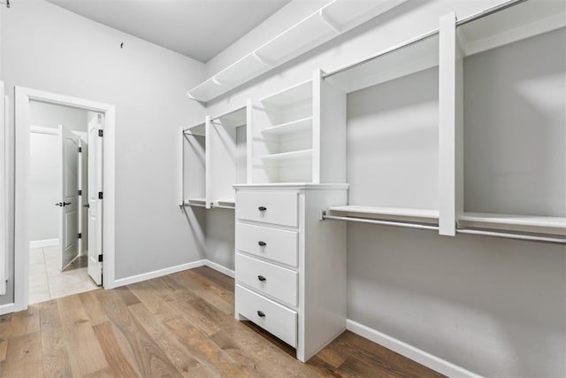 9041 NW 147th Ter, Yukon, OK 73099 - spacious closet with wood finished floors