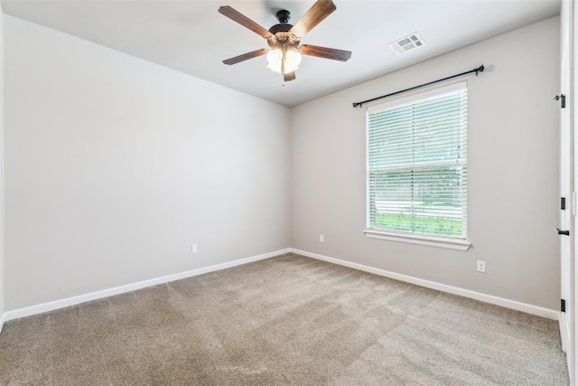 9041 NW 147th Ter, Yukon, OK 73099 - carpeted empty room with baseboards and a ceiling fan