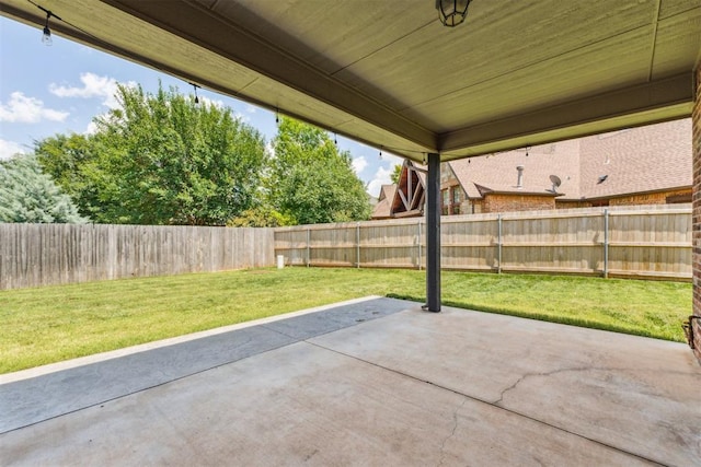 9041 NW 147th Ter, Yukon, OK 73099 - fenced backyard featuring a patio area