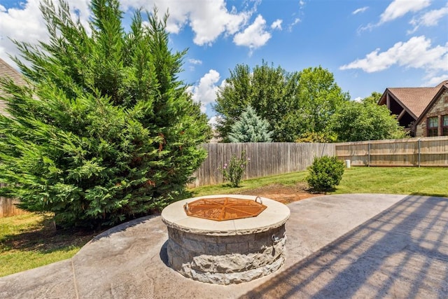 9041 NW 147th Ter, Yukon, OK 73099 - fenced backyard with an outdoor fire pit and a patio