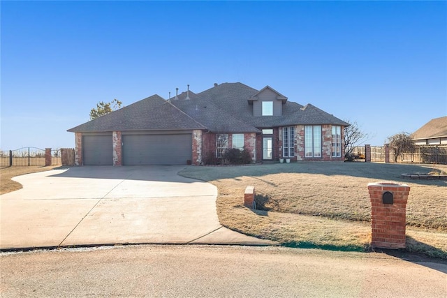 1045 Belmont Pl, Yukon, OK 73099 - traditional-style home with brick siding, an attached garage, driveway, and roof with shingles
