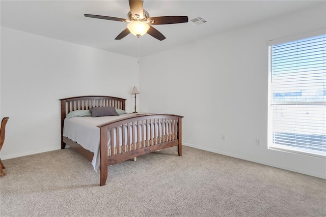 1045 Belmont Pl, Yukon, OK 73099 - carpeted bedroom featuring baseboards and ceiling fan