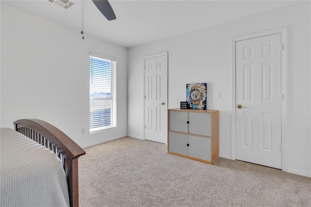 1045 Belmont Pl, Yukon, OK 73099 - bedroom featuring light carpet and a ceiling fan