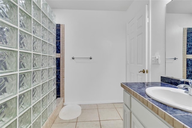 1045 Belmont Pl, Yukon, OK 73099 - full bath with tile patterned floors, vanity, and a tile shower