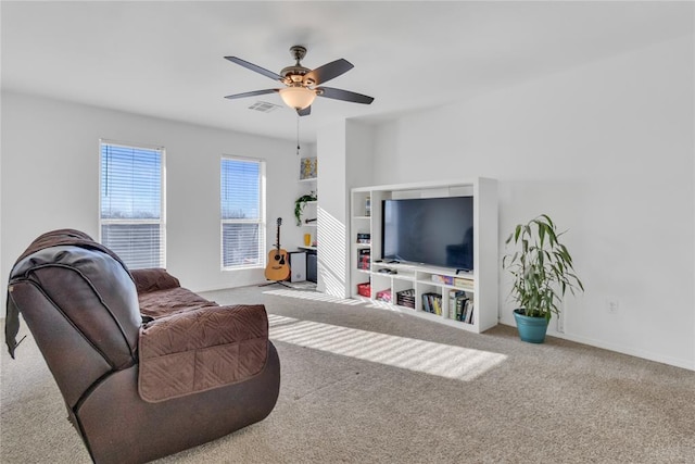 1045 Belmont Pl, Yukon, OK 73099 - carpeted living area with a ceiling fan and baseboards