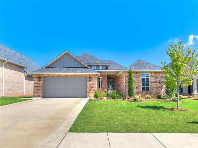 201 Pont Neuf Ct, Edmond, OK 73034 - view of front facade with brick siding, board and batten siding, an attached garage, and a front yard