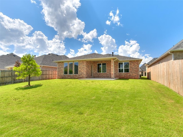 201 Pont Neuf Ct, Edmond, OK 73034 - back of house featuring brick siding and a patio area