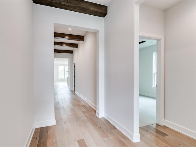 201 Pont Neuf Ct, Edmond, OK 73034 - hallway with beamed ceiling and light wood finished floors