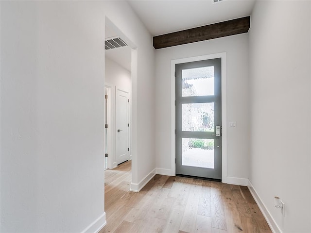 201 Pont Neuf Ct, Edmond, OK 73034 - entrance foyer featuring healthy amount of natural light, light wood finished floors, and beamed ceiling
