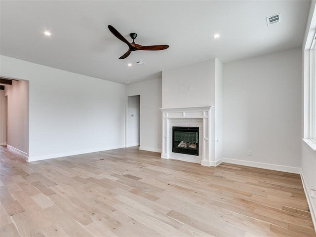201 Pont Neuf Ct, Edmond, OK 73034 - unfurnished living room featuring ceiling fan, a fireplace, light wood-style floors, and recessed lighting