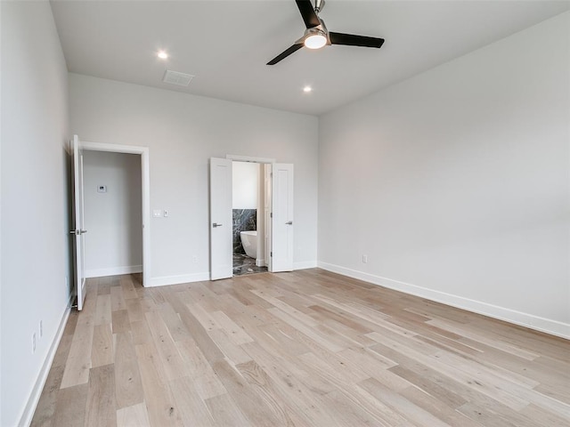 201 Pont Neuf Ct, Edmond, OK 73034 - unfurnished bedroom featuring light wood finished floors, connected bathroom, recessed lighting, and ceiling fan