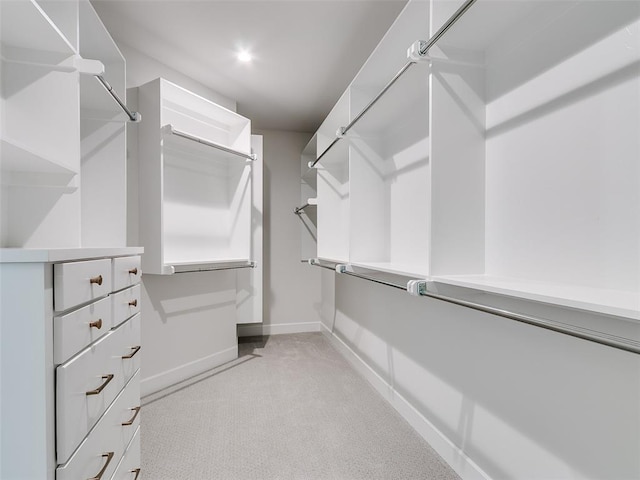201 Pont Neuf Ct, Edmond, OK 73034 - walk in closet featuring light carpet