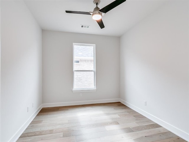 201 Pont Neuf Ct, Edmond, OK 73034 - empty room with a ceiling fan and light wood finished floors