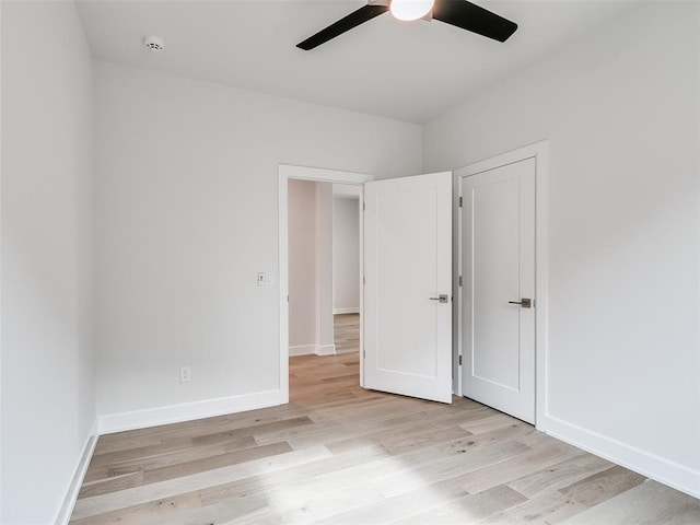 201 Pont Neuf Ct, Edmond, OK 73034 - unfurnished bedroom with light wood finished floors and a ceiling fan