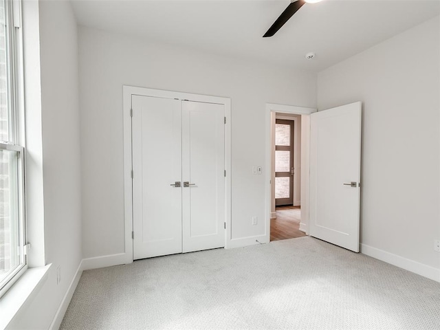 201 Pont Neuf Ct, Edmond, OK 73034 - unfurnished bedroom featuring carpet floors, a closet, and a ceiling fan