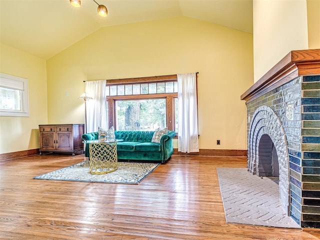 701 NW 21st St, Oklahoma City, OK 73103 - living room with wood finished floors, plenty of natural light, and vaulted ceiling