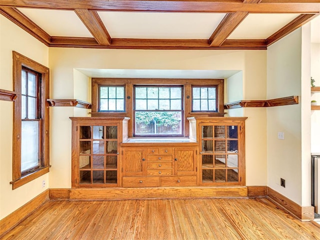701 NW 21st St, Oklahoma City, OK 73103 - unfurnished living room featuring wood finished floors, coffered ceiling, healthy amount of natural light, crown molding, and beam ceiling