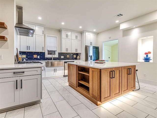701 NW 21st St, Oklahoma City, OK 73103 - kitchen with open shelves, appliances with stainless steel finishes, ventilation hood, a kitchen island, and recessed lighting