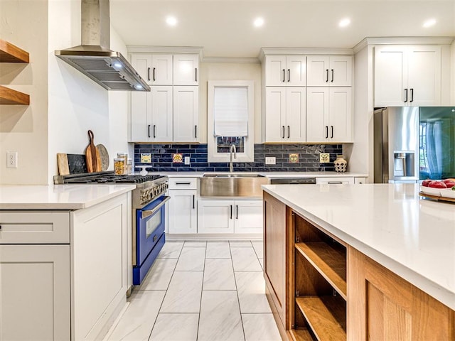 701 NW 21st St, Oklahoma City, OK 73103 - kitchen featuring open shelves, wall chimney exhaust hood, stainless steel appliances, light countertops, and white cabinets