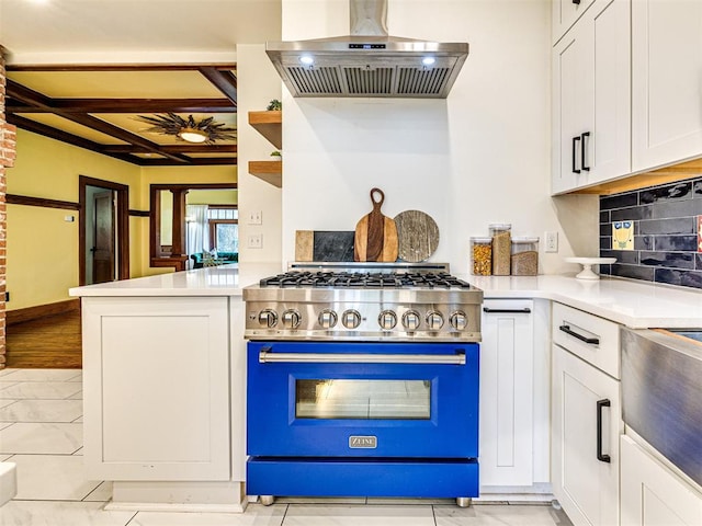 701 NW 21st St, Oklahoma City, OK 73103 - kitchen with premium range, wall chimney exhaust hood, coffered ceiling, white cabinets, and light countertops