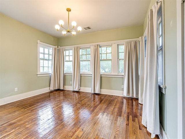 701 NW 21st St, Oklahoma City, OK 73103 - empty room with a chandelier and wood-type flooring