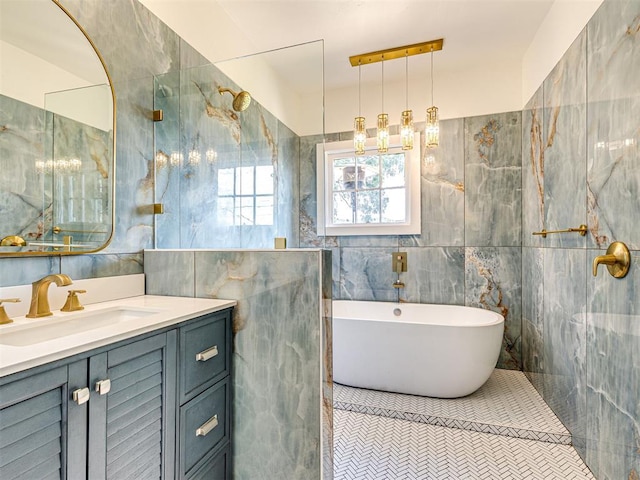 701 NW 21st St, Oklahoma City, OK 73103 - full bathroom with tile walls, a soaking tub, and vanity