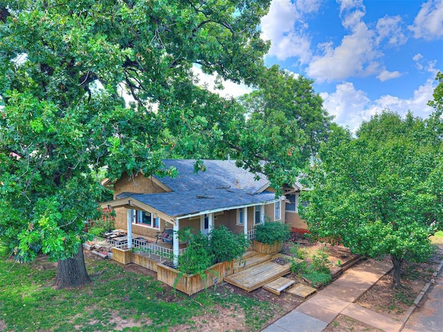 701 NW 21st St, Oklahoma City, OK 73103 - rear view of property featuring roof with shingles