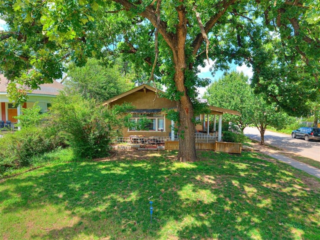 701 NW 21st St, Oklahoma City, OK 73103 - view of front of house featuring a front yard and a porch