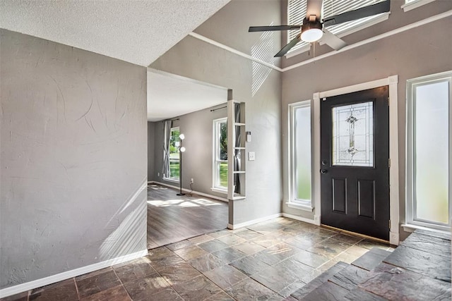 11904 Somerville Dr, Yukon, OK 73099 - foyer entrance with stone tile floors and ceiling fan