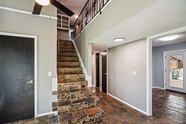 11904 Somerville Dr, Yukon, OK 73099 - stairway featuring stone finish flooring and ceiling fan