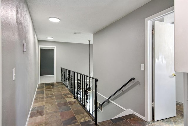 11904 Somerville Dr, Yukon, OK 73099 - staircase featuring stone finish floors and baseboards