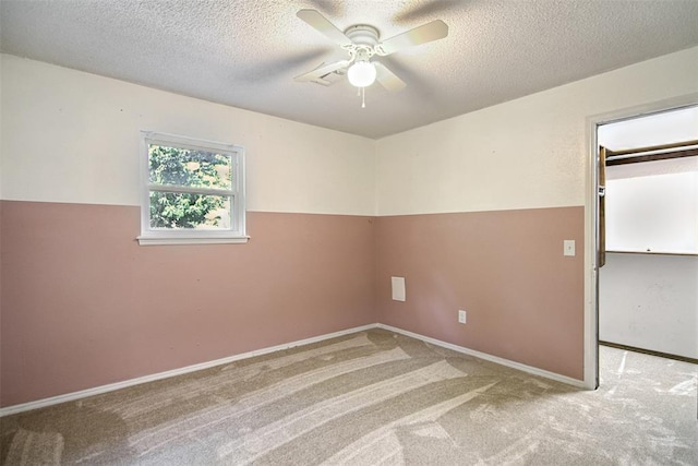 11904 Somerville Dr, Yukon, OK 73099 - spare room featuring carpet floors, ceiling fan, and a textured ceiling
