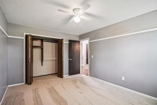 11904 Somerville Dr, Yukon, OK 73099 - unfurnished bedroom with a textured ceiling, carpet flooring, and a ceiling fan