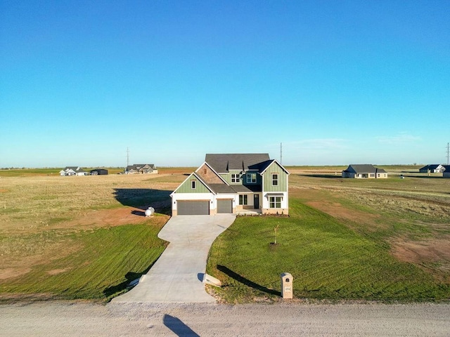 4334 White Ash Dr, Piedmont, OK 73078 - view of front of property with concrete driveway, board and batten siding, a garage, and a front yard