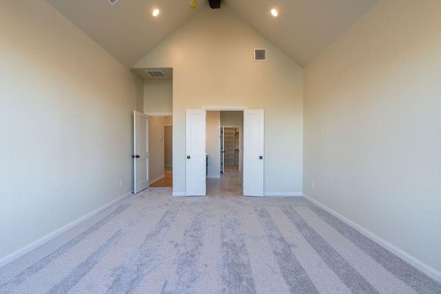 4334 White Ash Dr, Piedmont, OK 73078 - unfurnished bedroom with high vaulted ceiling, light colored carpet, and recessed lighting
