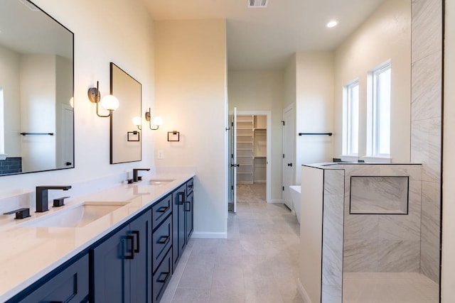 4334 White Ash Dr, Piedmont, OK 73078 - bathroom featuring double vanity, a bath, a spacious closet, tiled shower, and tile patterned flooring