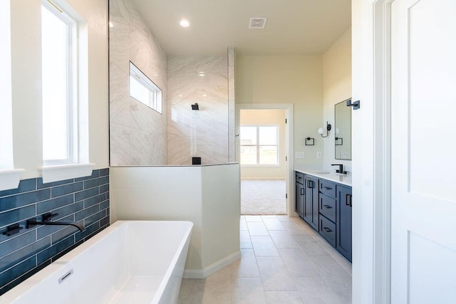 4334 White Ash Dr, Piedmont, OK 73078 - full bath with a soaking tub, vanity, healthy amount of natural light, and walk in shower