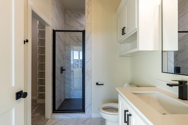 4334 White Ash Dr, Piedmont, OK 73078 - bathroom with a marble finish shower, vanity, a walk in closet, and marble look tiles
