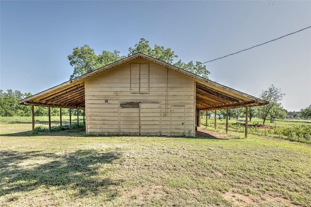2299 Coretta Ave, Duncan, OK 73534 - view of pole building featuring a lawn and a carport