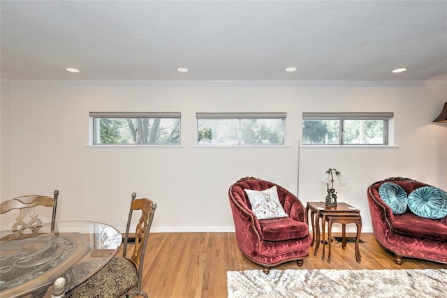 2299 Coretta Ave, Duncan, OK 73534 - living area with healthy amount of natural light, wood finished floors, recessed lighting, and crown molding