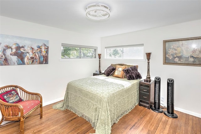 2299 Coretta Ave, Duncan, OK 73534 - bedroom with baseboards and wood finished floors