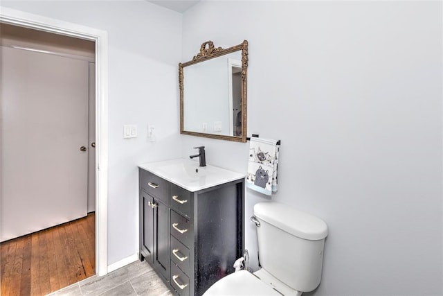2299 Coretta Ave, Duncan, OK 73534 - bathroom featuring vanity and wood finished floors