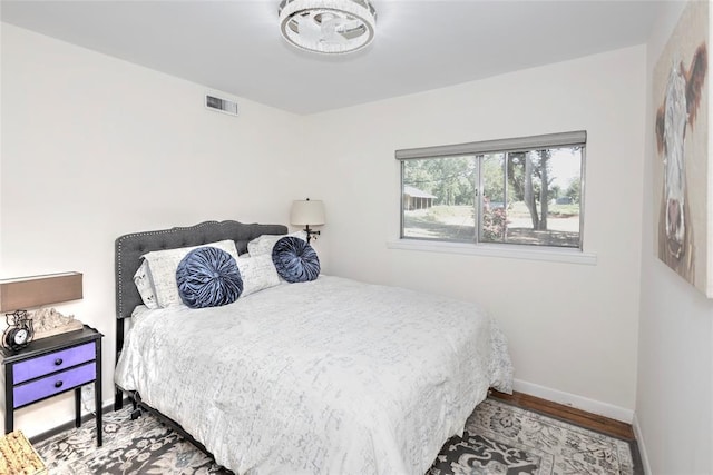 2299 Coretta Ave, Duncan, OK 73534 - bedroom with wood finished floors and baseboards