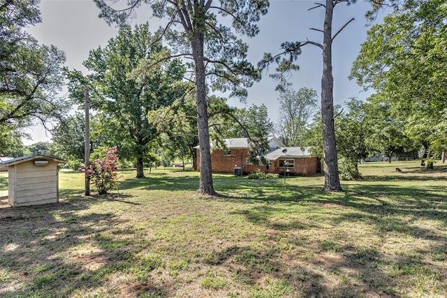 2299 Coretta Ave, Duncan, OK 73534 - view of grassy yard with a storage unit