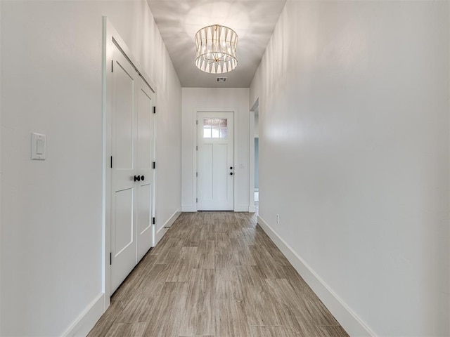 6881 Lake View Ct, Cashion, OK 73016 - entryway with light wood-style floors and a chandelier