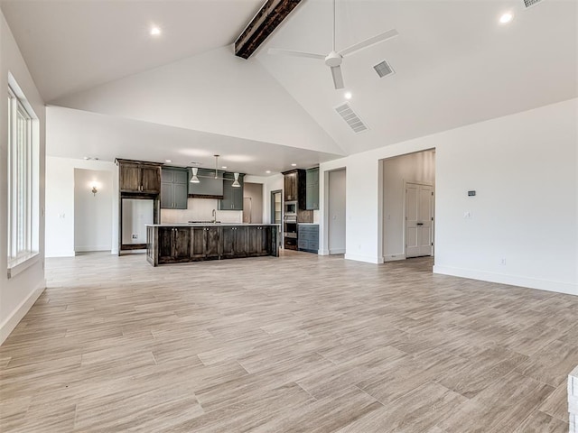 6881 Lake View Ct, Cashion, OK 73016 - unfurnished living room featuring high vaulted ceiling, a ceiling fan, beamed ceiling, recessed lighting, and light wood finished floors