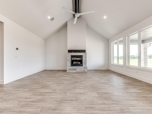 6881 Lake View Ct, Cashion, OK 73016 - unfurnished living room featuring ceiling fan, a fireplace, light wood-style flooring, and high vaulted ceiling