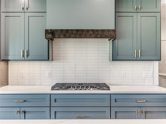 6881 Lake View Ct, Cashion, OK 73016 - kitchen with stainless steel gas cooktop and backsplash